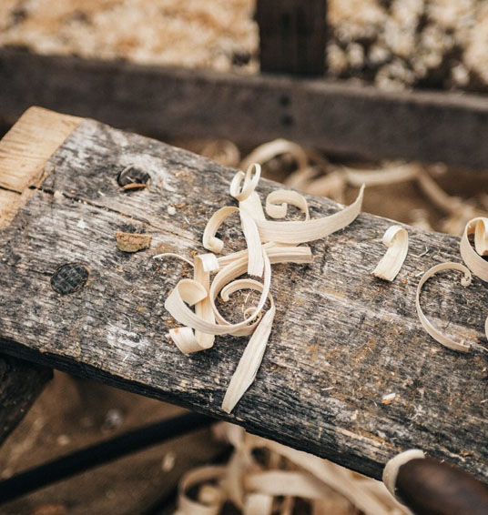 Wood shavings on a piece of wood