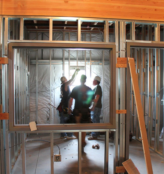 Reliable Building Solutions general contractors framing a home.