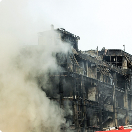 Multi-story building charred by fire