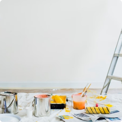 paint buckets open in a room being repainted